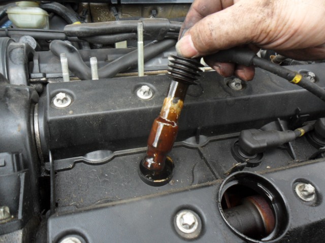 Oil in Spark Plug Well.JPG